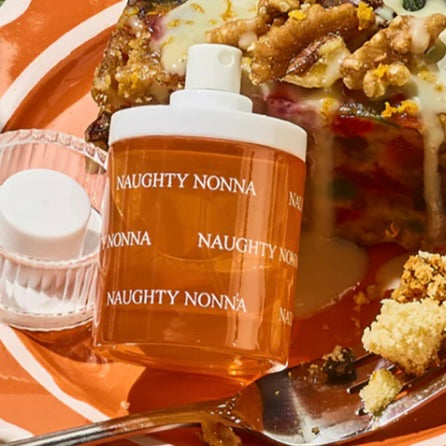 Close-up of a fragrance sample of Naughty Nonna, highlighting its warm, rich, and festive notes for a sweet yet mischievous scent experience