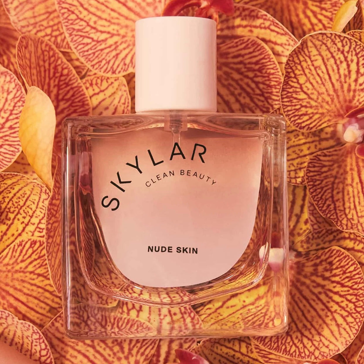 Close-up of a fragrance sample of Nude Skin, highlighting its fresh, floral, and warm amber notes for an intimate and glowing scent experience