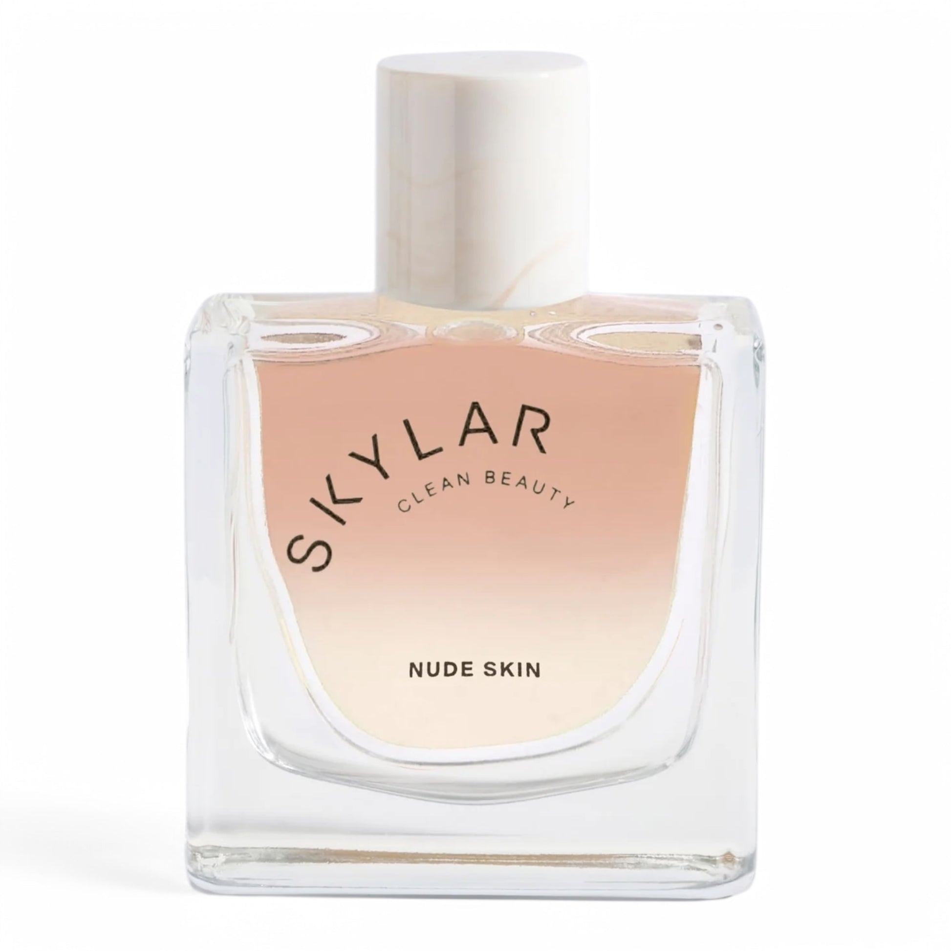 A decant of Skylar Nude Skin, a soft and radiant fragrance with tropical fruits, tiger orchid, and warm vanilla, available in perfume samples